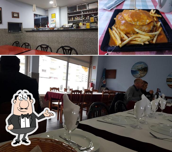 This is the picture showing interior and fries at Restaurante Os Manos