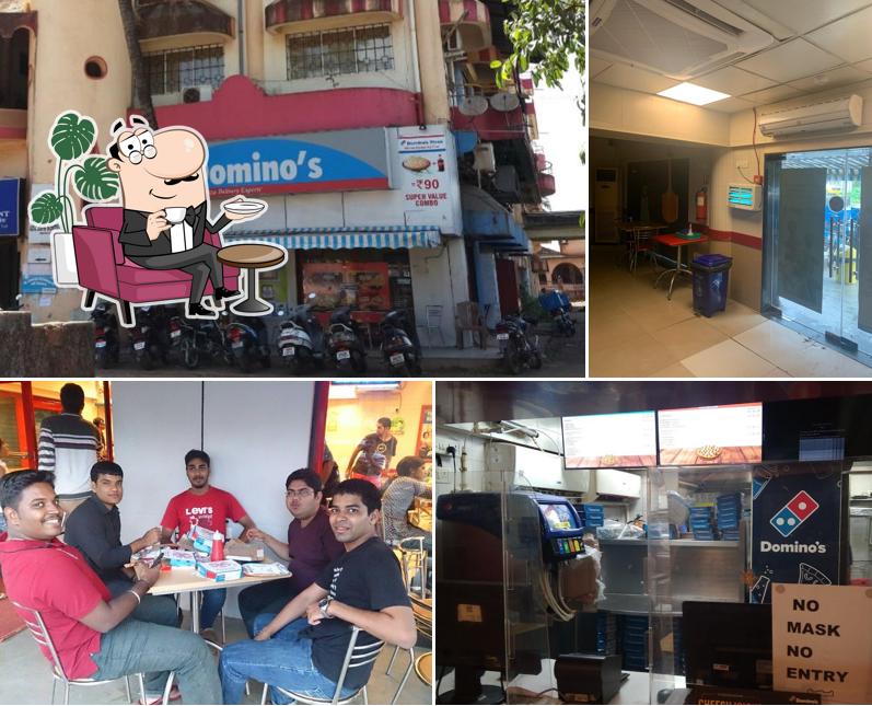 Take a seat at one of the tables at Domino's Pizza - Margao Goa