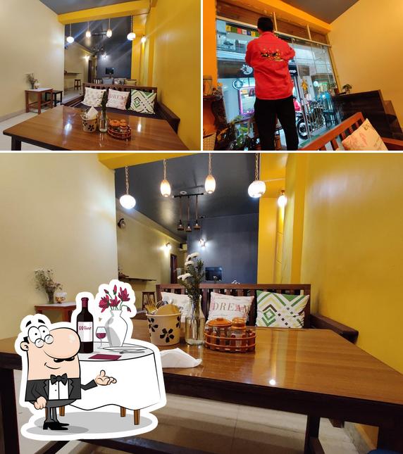 The picture of dining table and interior at Arunachali Naloi’s Restaurant & Cafe