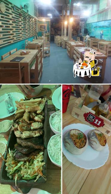 Entre diferentes coisas, comida e interior podem ser encontrados no Restaurante Rota do Peixe / Belém