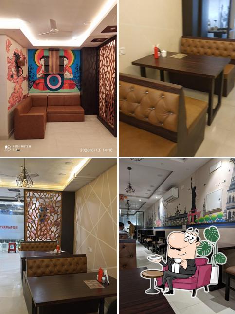 Take a seat at one of the tables at The Big Boss ( Multi Cuisine Resturent & Cafe)