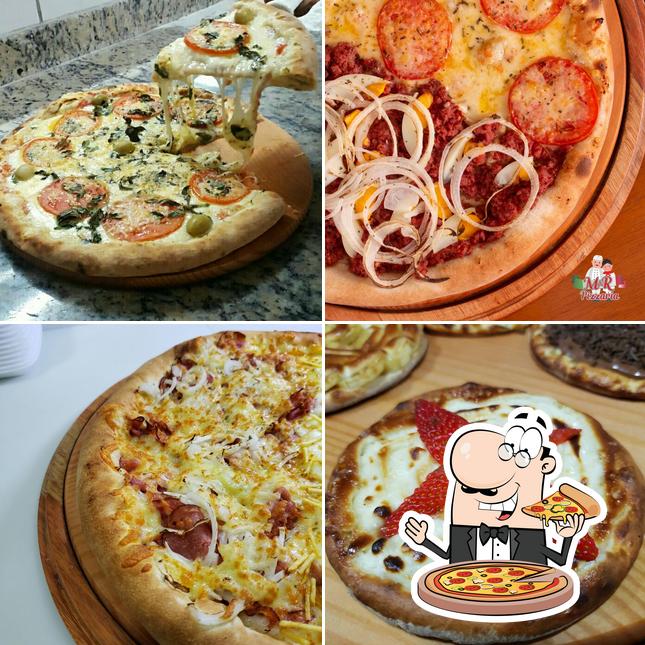 No M & R Pizzaria e Esfiharia - UNIDADE CENTRO, você pode desfrutar de pizza