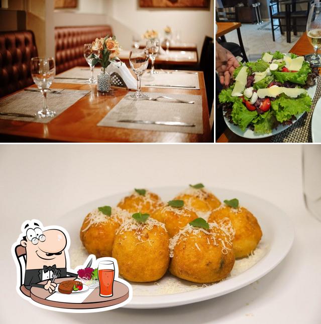 A ilustração a La Carbonara Trattoria e Pizza’s mesa de jantar e comida