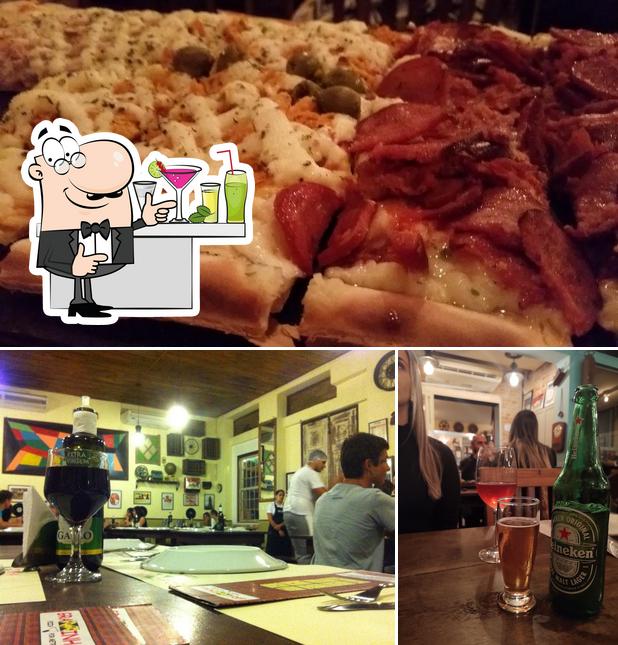 Confira a foto mostrando balcão de bar e bolo no Graminha Pizzaria Santos