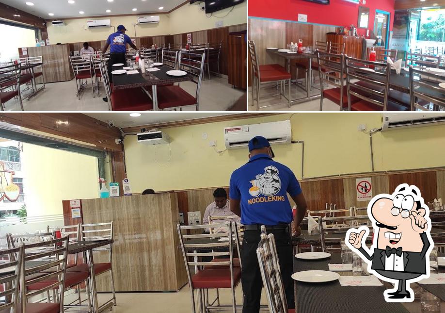 Take a seat at one of the tables at Noodle King
