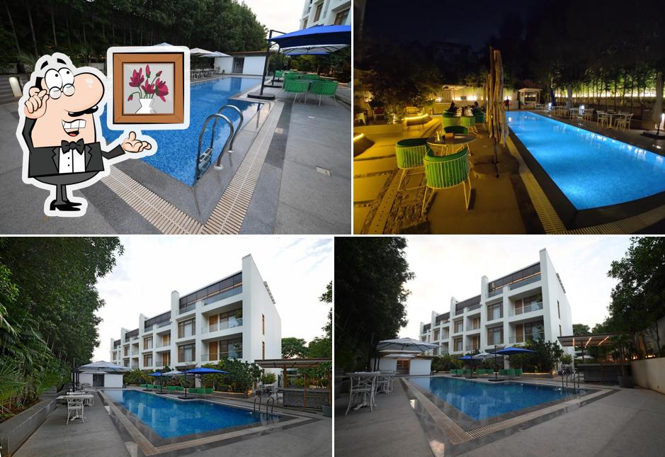 Take a seat at one of the tables at Grill by the Pool