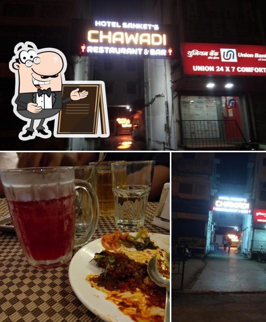 Check out the picture depicting exterior and pizza at Chawadi Restaurant & Bar