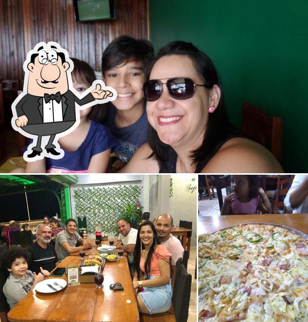 Sente em uma das mesas no Restaurante e Pizzaria Palmistes