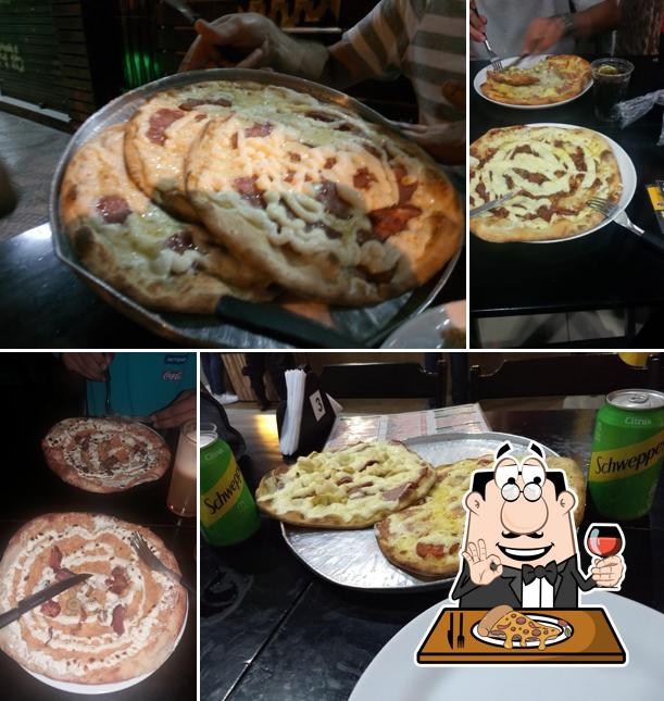 Escolha pizza no Malasana Hamburgueria e Pizzaria