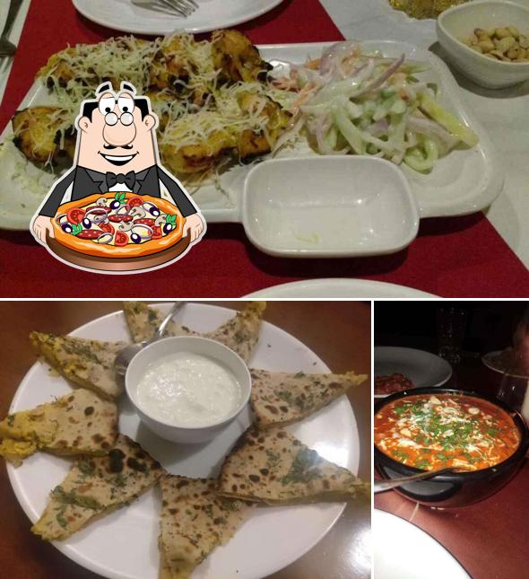 Try out pizza at Golden Curry By Hotel Grand Emerald