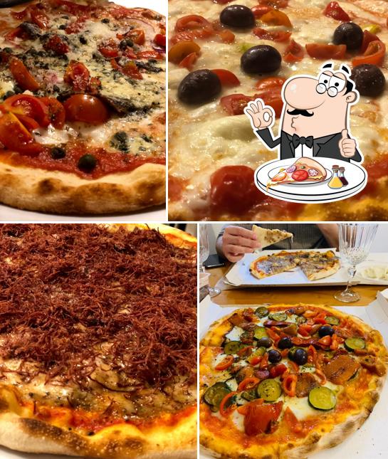 Prenditi una pizza a Pizzeria Risotteria da Mario Verona