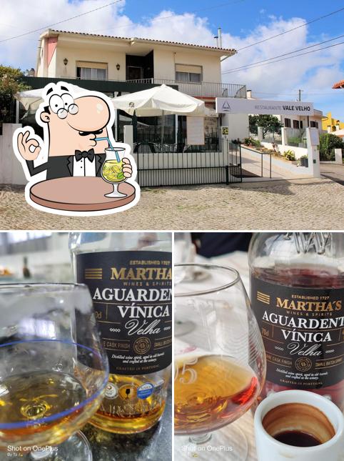 Take a look at the image displaying drink and exterior at Restaurante Vale Velho