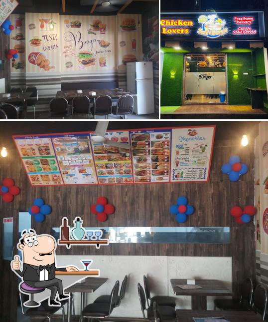 This is the picture depicting interior and exterior at Sam's Burger