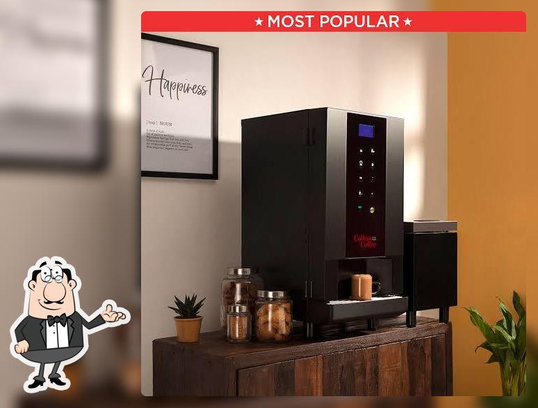 Take a seat at one of the tables at coffee day vending machine