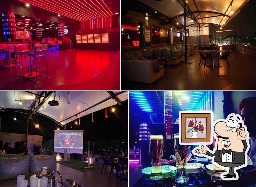 Take a seat at one of the tables at V Club & Lounge