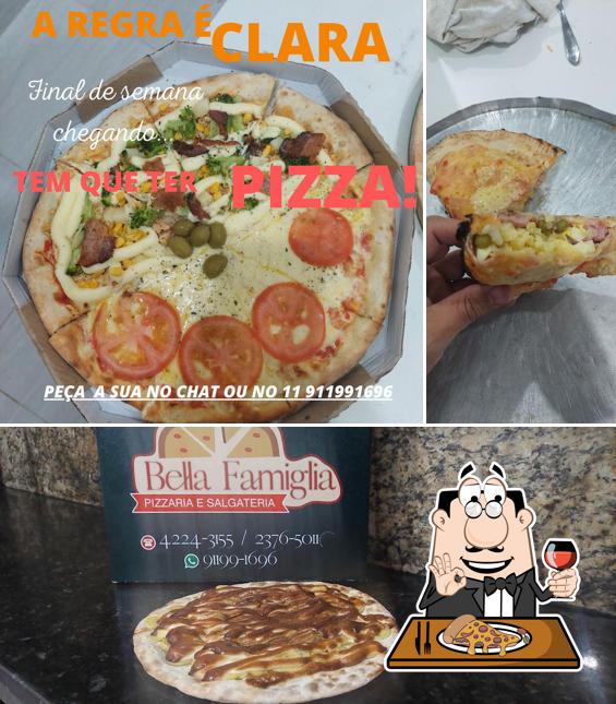 Consiga pizza no Bella Famiglia Pizzaria e Salgateria