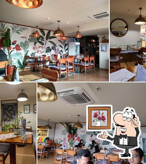 Take a seat at one of the tables at Fabcafe by Fabindia - Starling Mall, Noida