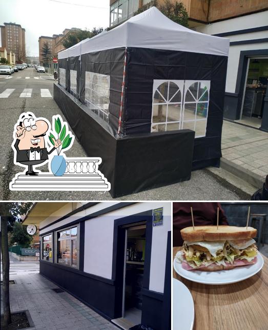 Take a look at the photo showing exterior and burger at bar mabe