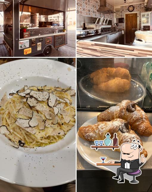This is the photo depicting interior and food at Lo spaghetto d’oro
