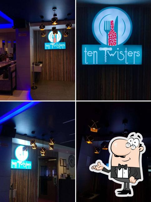 Take a seat at one of the tables at Ten Twisters (Barbeque Restaurant)