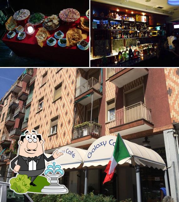 Dai un’occhiata alla foto che raffigura la esterno e tavolo da pranzo di Galaxy Café