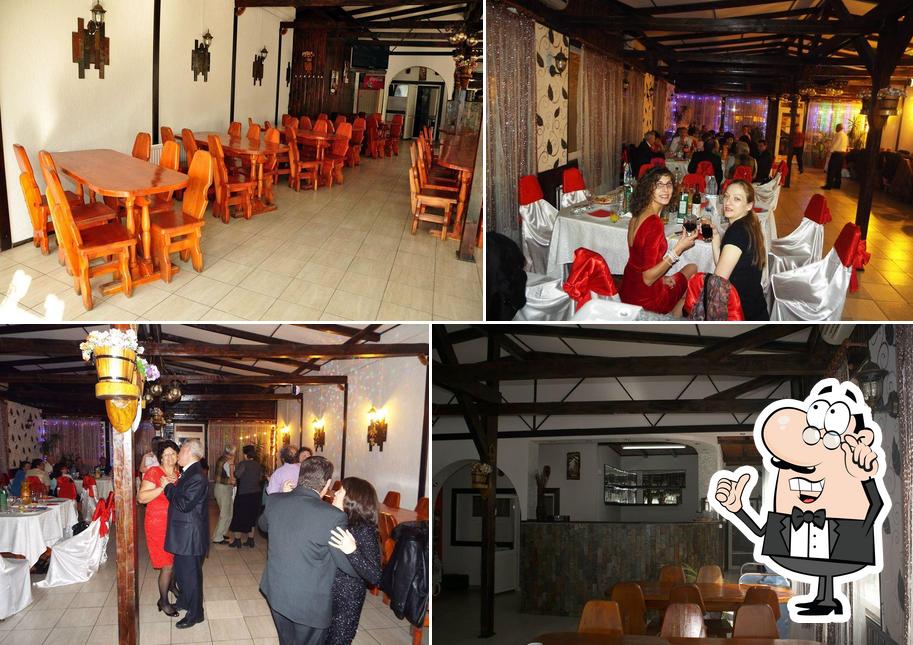 Installez-vous à l'une des tables de Restaurant Voluntari - La Stejaru'