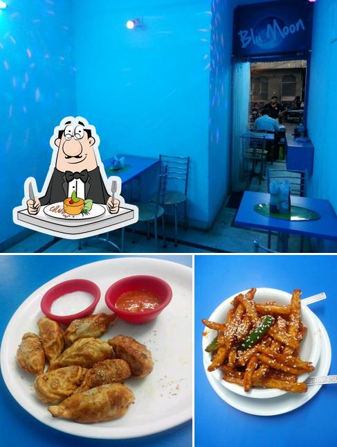 The photo of food and interior at Blu Moon Restaurant