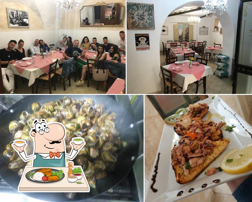 La immagine di cibo e tavolo da pranzo da Trattoria Pizzeria San Giuseppe