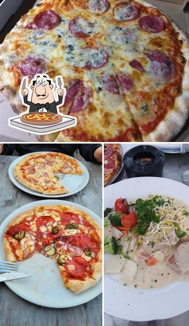 Попробуйте пиццу в "Ristorante • Pizzeria Al Porto"
