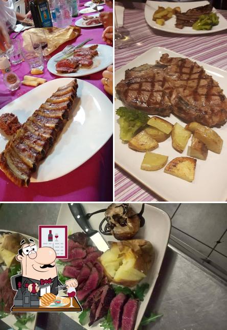 Holt ein Fleischgericht bei At Bacioch (Restaurant)