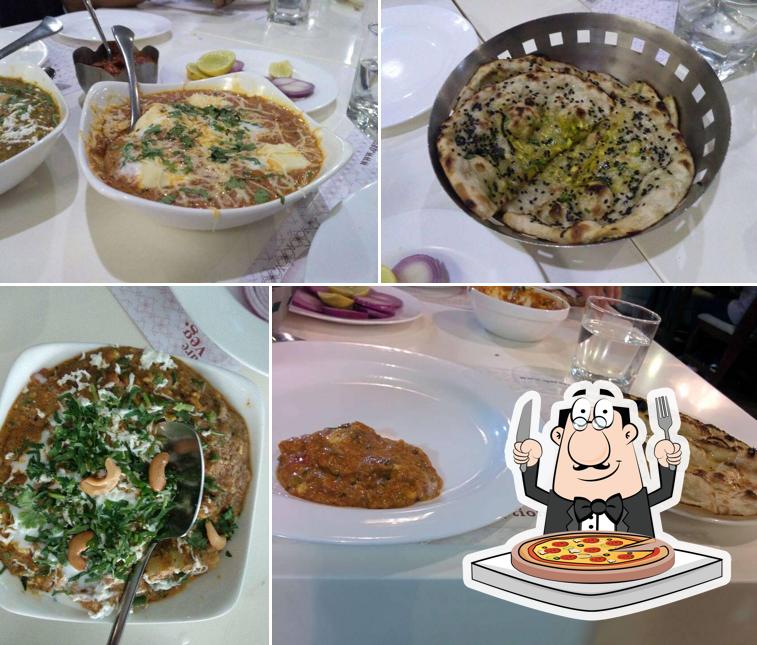 Pick pizza at Qaraar Banquets - Best Banquet Hall in Ahmedabad