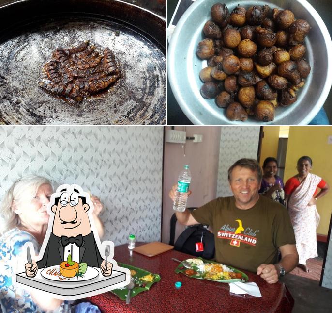 Take a look at the photo showing food and dining table at SHEEBAS MESS HOUSE