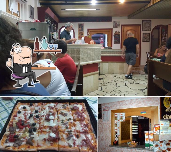 La immagine di interni e pizza da Mucelli