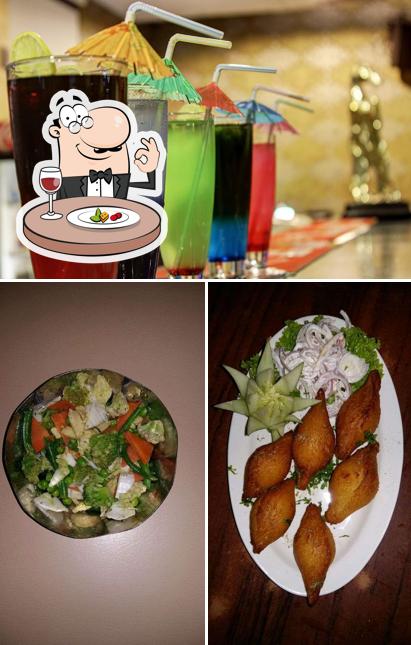 Take a look at the photo displaying food and beer at Green Lounge