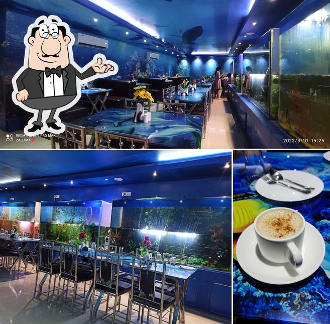 Take a look at the photo showing interior and beverage at Blue O restaurant