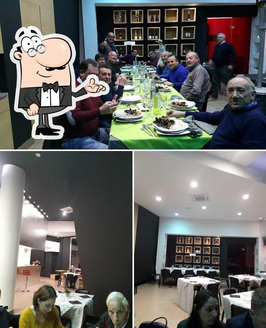 Guarda la immagine che raffigura la interni e tavolo da pranzo di Quartara Concept Restaurant Pizzeria