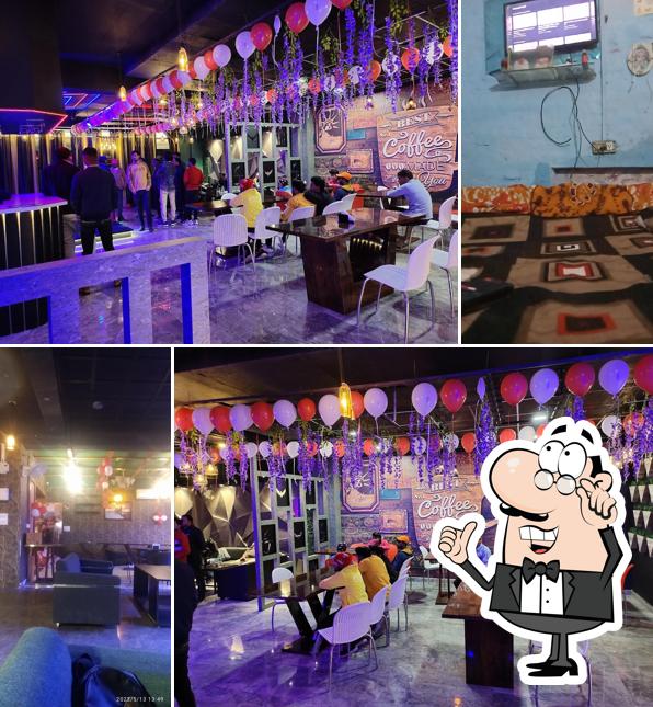 Take a seat at one of the tables at Love wings cafe and restro