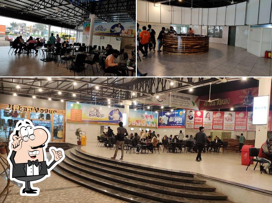 Take a seat at one of the tables at Pappu Ji Ka Dhaba and Family Restaurant