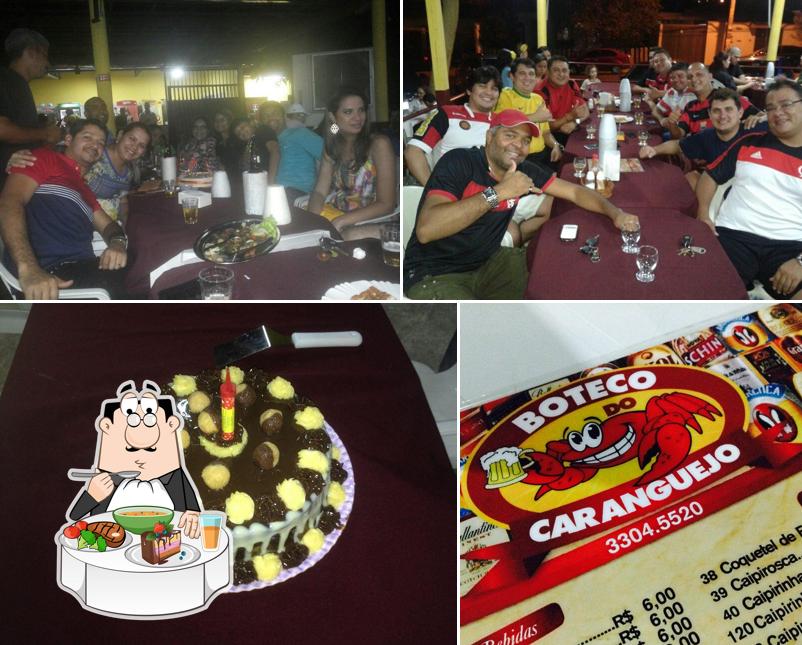 O Boteco Do Caranguejo se destaca pelo mesa de jantar e comida