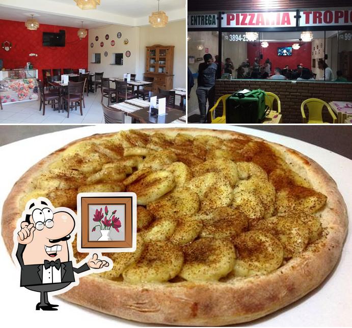 Esta é a foto apresentando interior e bolo no Pizzaria Tropical