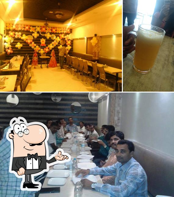 Check out the picture depicting interior and beer at Rasika Veg Restaurant