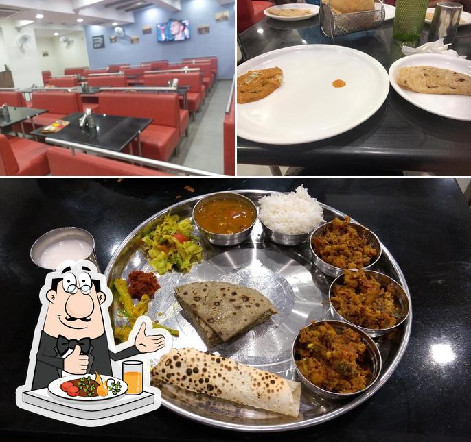 Take a look at the photo depicting food and interior at Shri Khodiyar Kathiyawad Dhaba