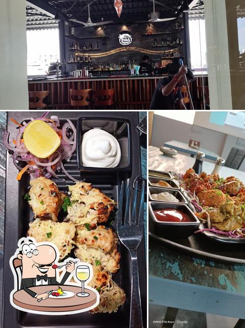 The photo of food and bar counter at Float Gastro Pub