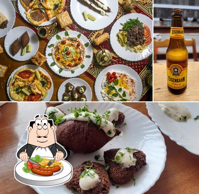 Esta é a foto apresentando comida e cerveja no Kebab Faruk - Comida Árabe
