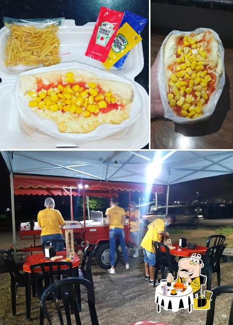 Entre diferentes coisas, comida e interior podem ser encontrados no Hot Dog Supremo
