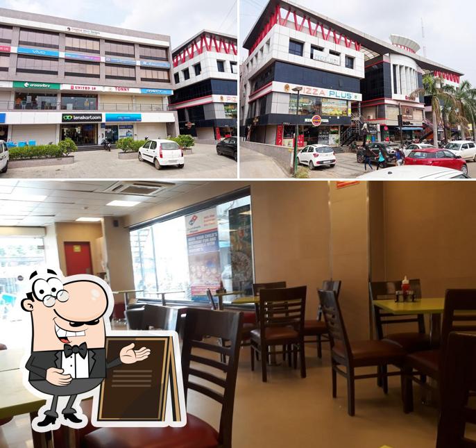 Take a look at the picture showing exterior and interior at Domino's Pizza Chalali, Nadiad