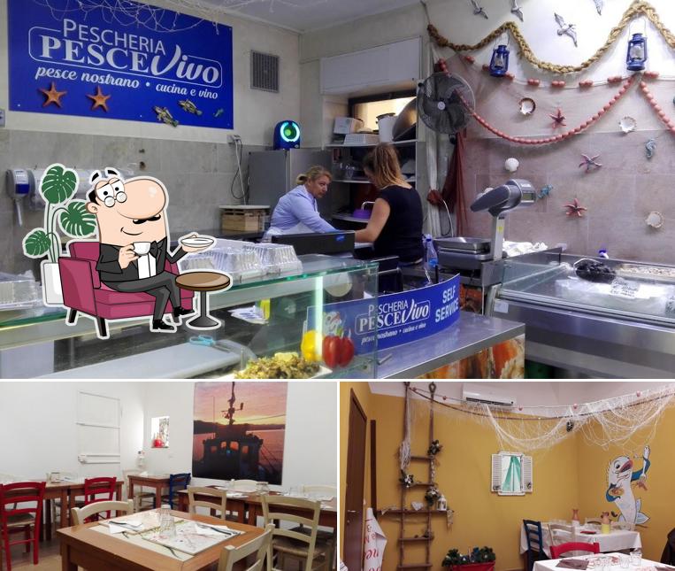 Questa è la foto che presenta la interni e tavolo da pranzo di Pescio Vivo Cuxinn-a Zeneize