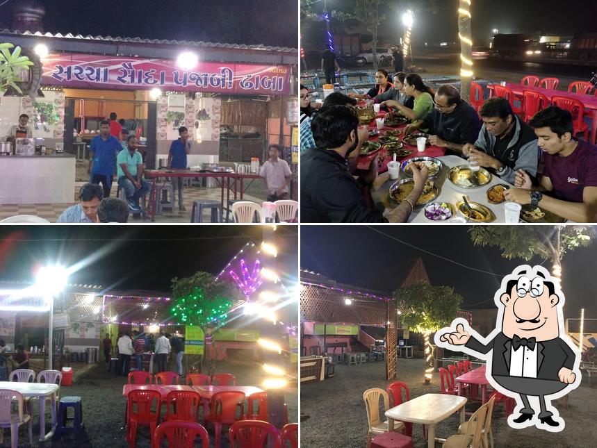 Take a seat at one of the tables at Sacha Sauda Punjabi Dhaba