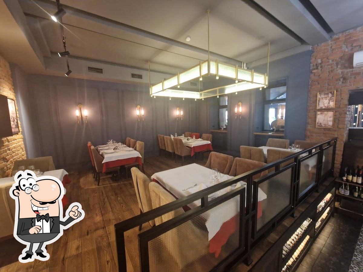 Take a seat at one of the tables at Serbian Restaurant Subbotica.