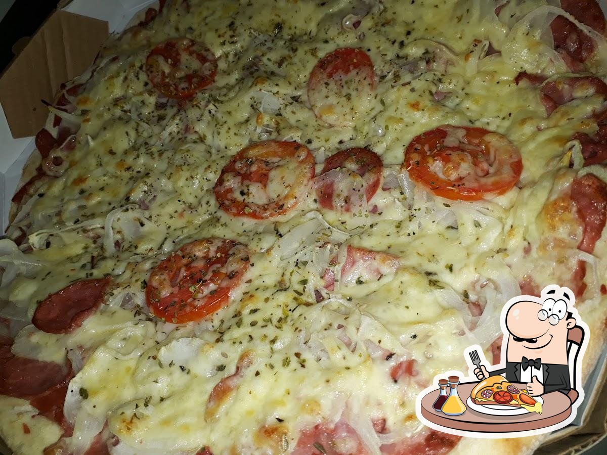 Peça pizza no Primavera Pizza Bar.
